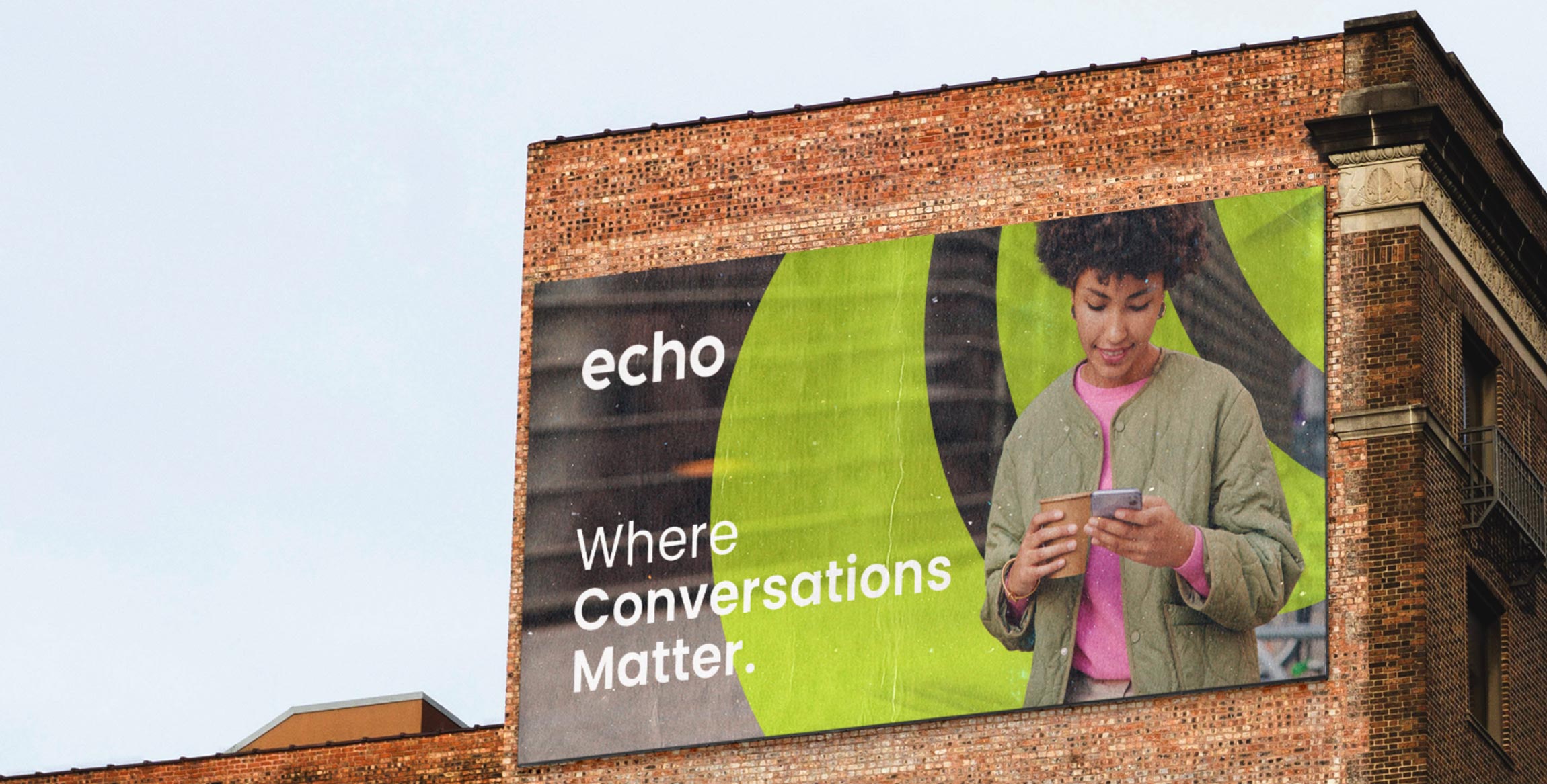 billboard image of a woman using her mobile advertising echo